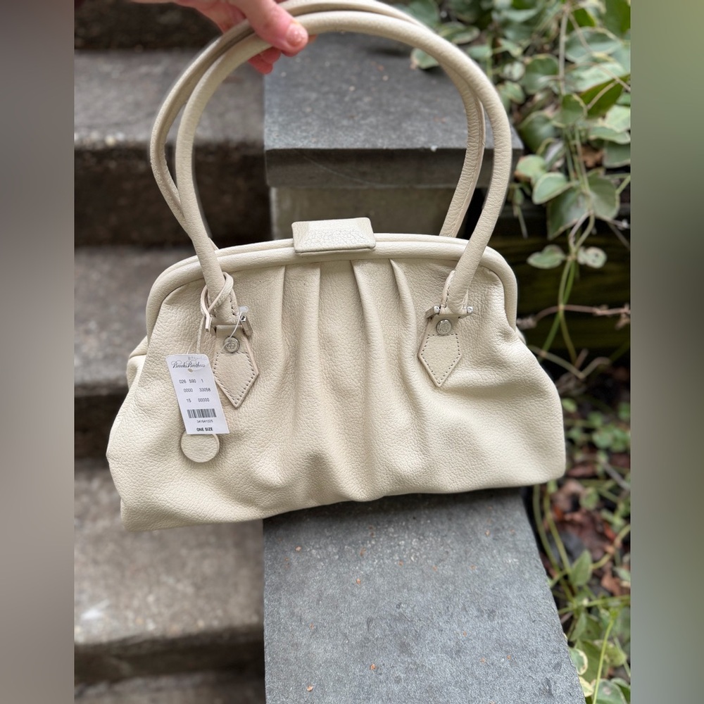 New with tags Brooks Brothers leather snap top purse in rich cream color